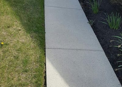 Sidewalk after power washing.